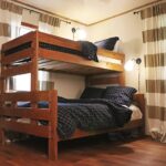 Bunk bedroom with two sets of beds at Cottage in the Woods, family-friendly cabin Drasco AR