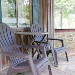 Front porch sitting area at Cottage in the Woods cabin rental