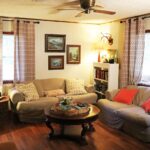 Cottage in the Woods living room with comfortable seating and wood-paneled walls, Drasco AR