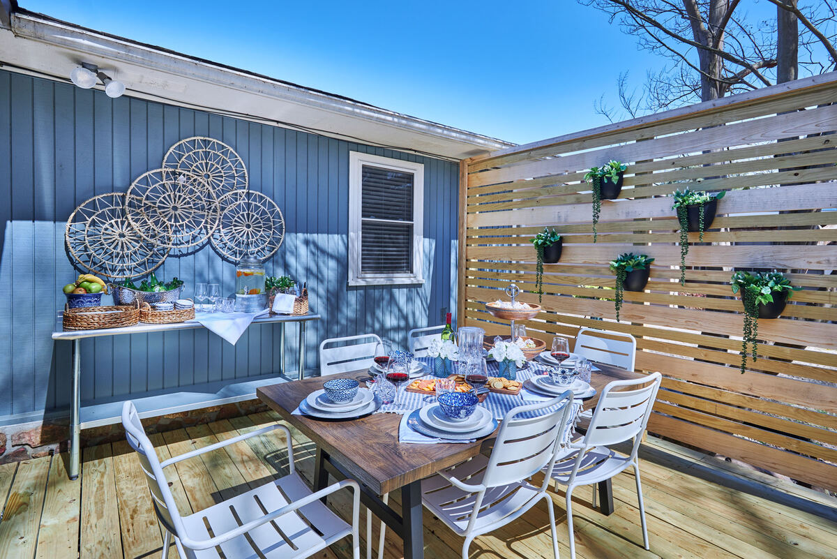 Outdoor deck dining with riverfront view at The Little Red Riviera, Heber Springs Arkansas