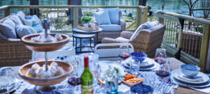 The Little Red Riviera back deck with riverside dining setup overlooking the Little Red River in Heber Springs